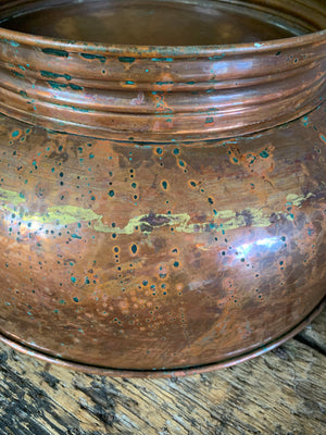 A large English beaten copper bowl
