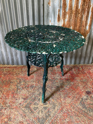 A green garden table and chairs set