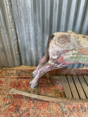Carved wooden rocking horse