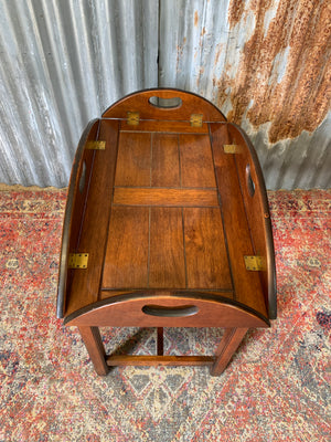 A mahogany butler's tray table