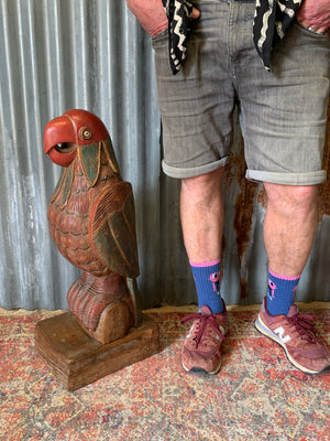 A very large carved wooden polychrome parrot statue