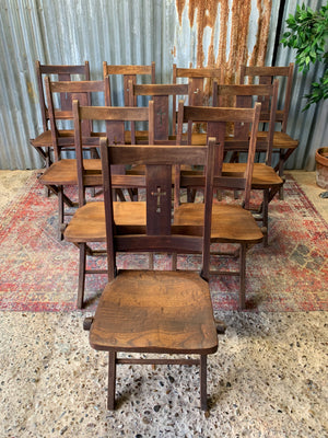 An Edwardian oak folding chapel chair by Mealing Bros