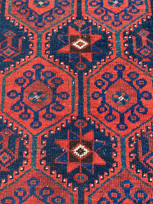 A long red ground blue Persian runner rug ~ 304cm x 104cm