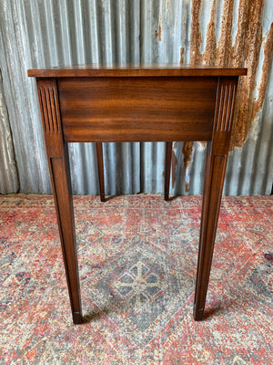 A serpentine desk and leather chair by Bevan Funnell