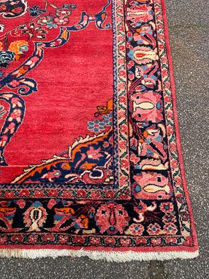 A very large rectangular red ground Persian floral rug ~ 12ft x 8ft