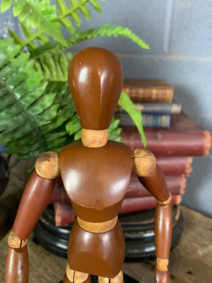 A two tone wooden artist's lay figure