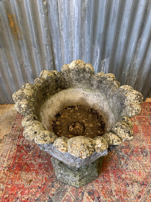 A pair of large acanthus cast stone urns