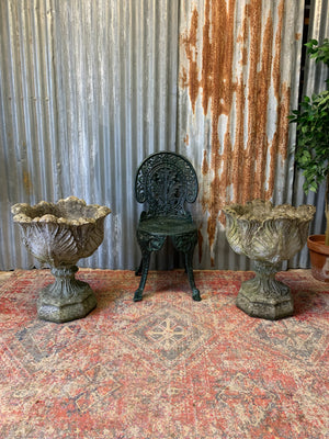 A pair of large acanthus cast stone urns