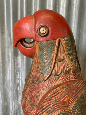 A very large carved wooden polychrome parrot statue