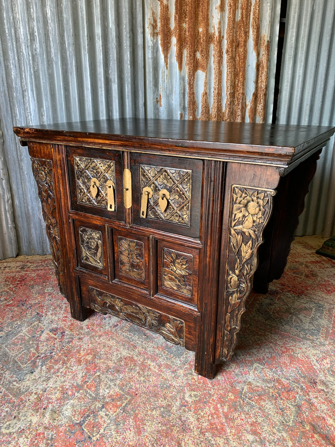 A carved wooden Chinese altar cabinet