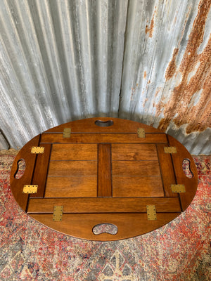 A mahogany butler's tray table