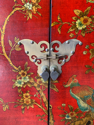 A red and gold lacquered chinoiserie cabinet