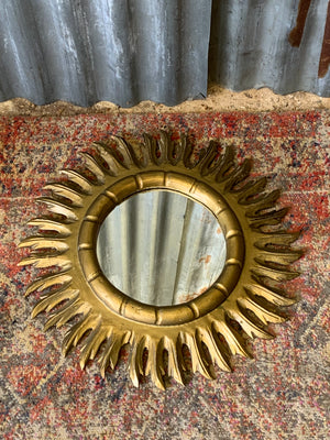 A Spanish giltwood sunburst mirror