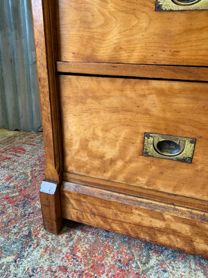 A satinwood chest of drawers