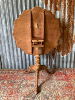 A Georgian style tilt top table with ball and claw feet