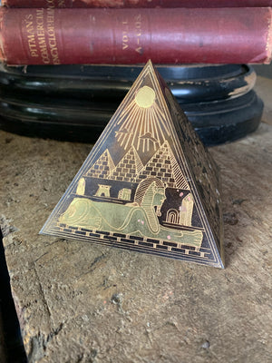 A group of four etched brass Egyptian revival pyramids