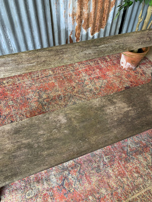 A cast iron and wooden garden bench