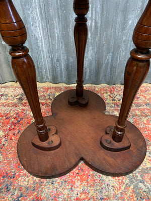 A carved mahogany occasional table with trefoil cloverleaf top