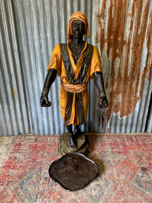 A full size Blackamoor figure with tray