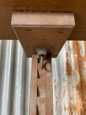 A floor standing and foldable wooden artist's easel