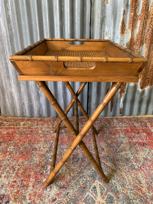 A faux bamboo butler's tray table