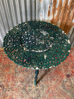 A green garden table and chairs set