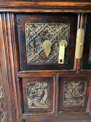 A carved wooden Chinese altar cabinet