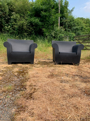 A pair of black Bubble Club garden chairs by Kartell