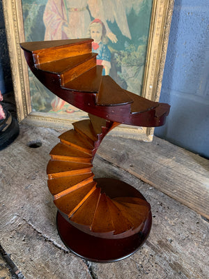 A wooden spiral staircase model