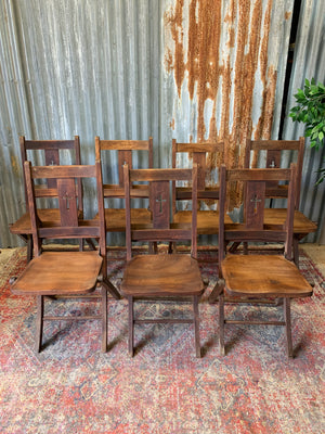 An Edwardian oak folding chapel chair by Mealing Bros