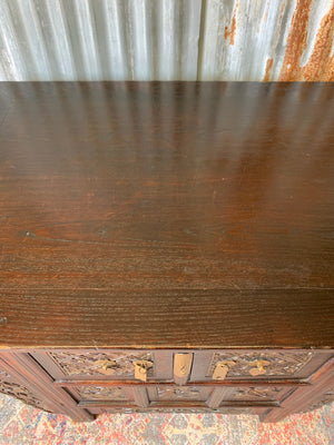 A carved wooden Chinese altar cabinet