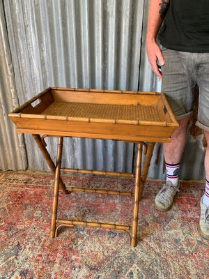 A faux bamboo butler's tray table