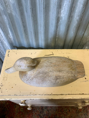 A wooden duck decoy