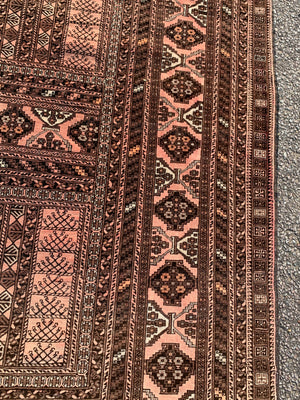 A Persian brown ground rectangular rug- 243cm x 166cm