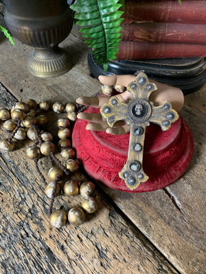 A set of oversized wooden rosary beads with memento mori motif