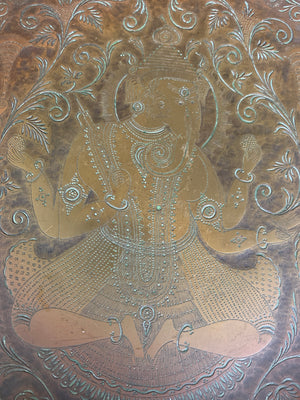 An Indian bronze dish adorned with Ganesha