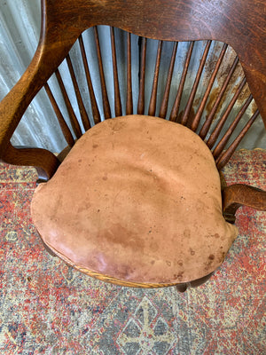 A banker's chair with caned seat