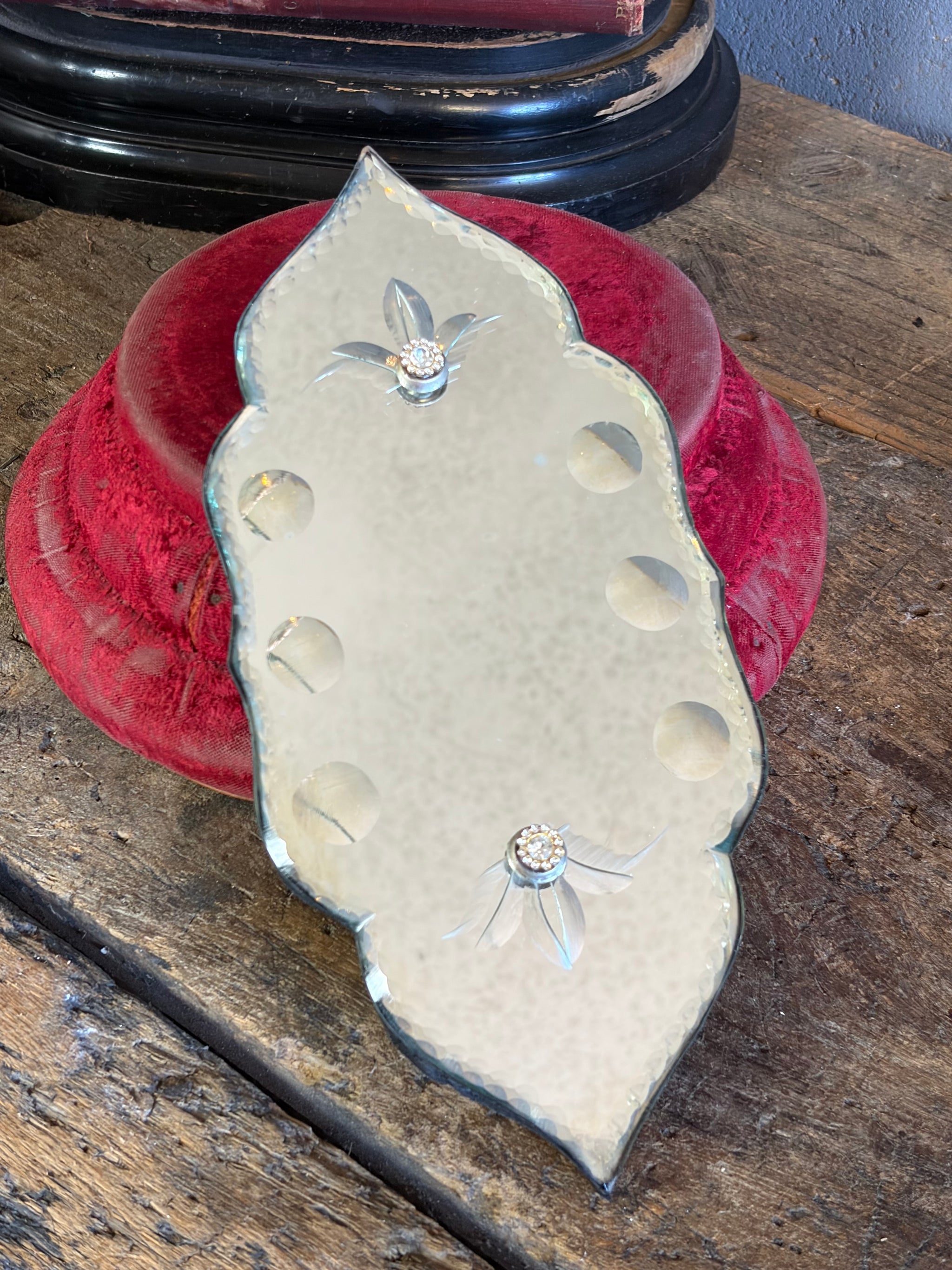 A slender Venetian-style mirror fragment