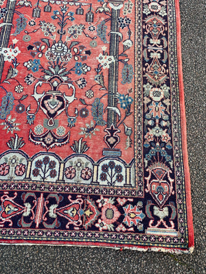 A large red ground niche or prayer rug- 202cm x 135cm