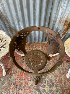 A cast iron Britannia garden table with marble top