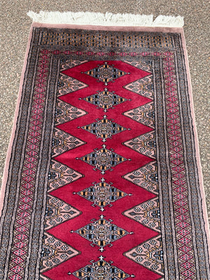 A long pink ground Persian runner rug ~ 318cm x 83cm