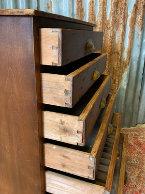 A pine chest of six drawers on castors