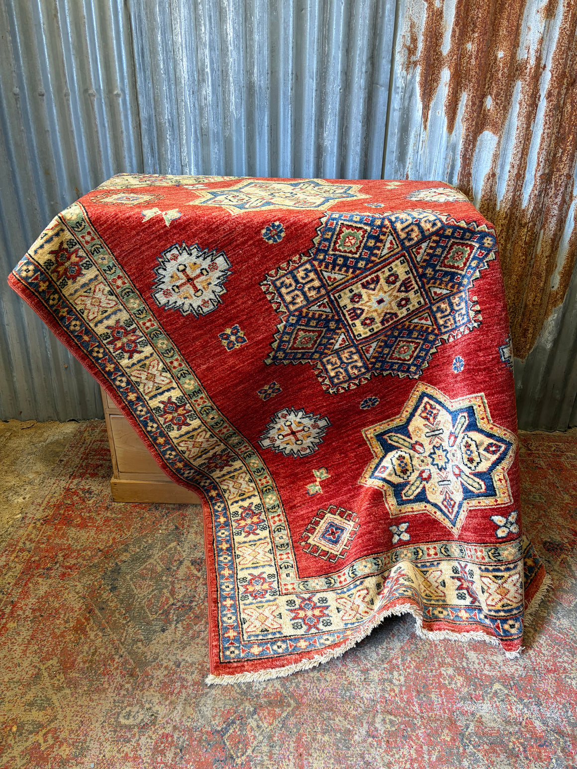 A red ground Kazak rug ~ 205cm x 161cm