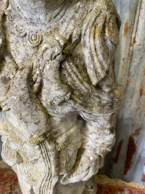 A cast stone garden statue of Guanyin