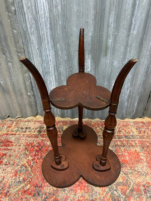 A carved mahogany occasional table with trefoil cloverleaf top