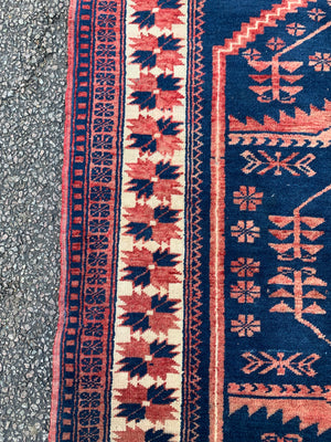 An Anatolian blue ground rug - 212cm x 114cm