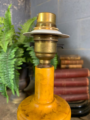 A pair of red and black toleware lamps