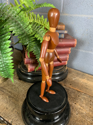 A two tone wooden artist's lay figure