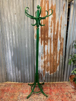 A tall bentwood coat stand with hat rack