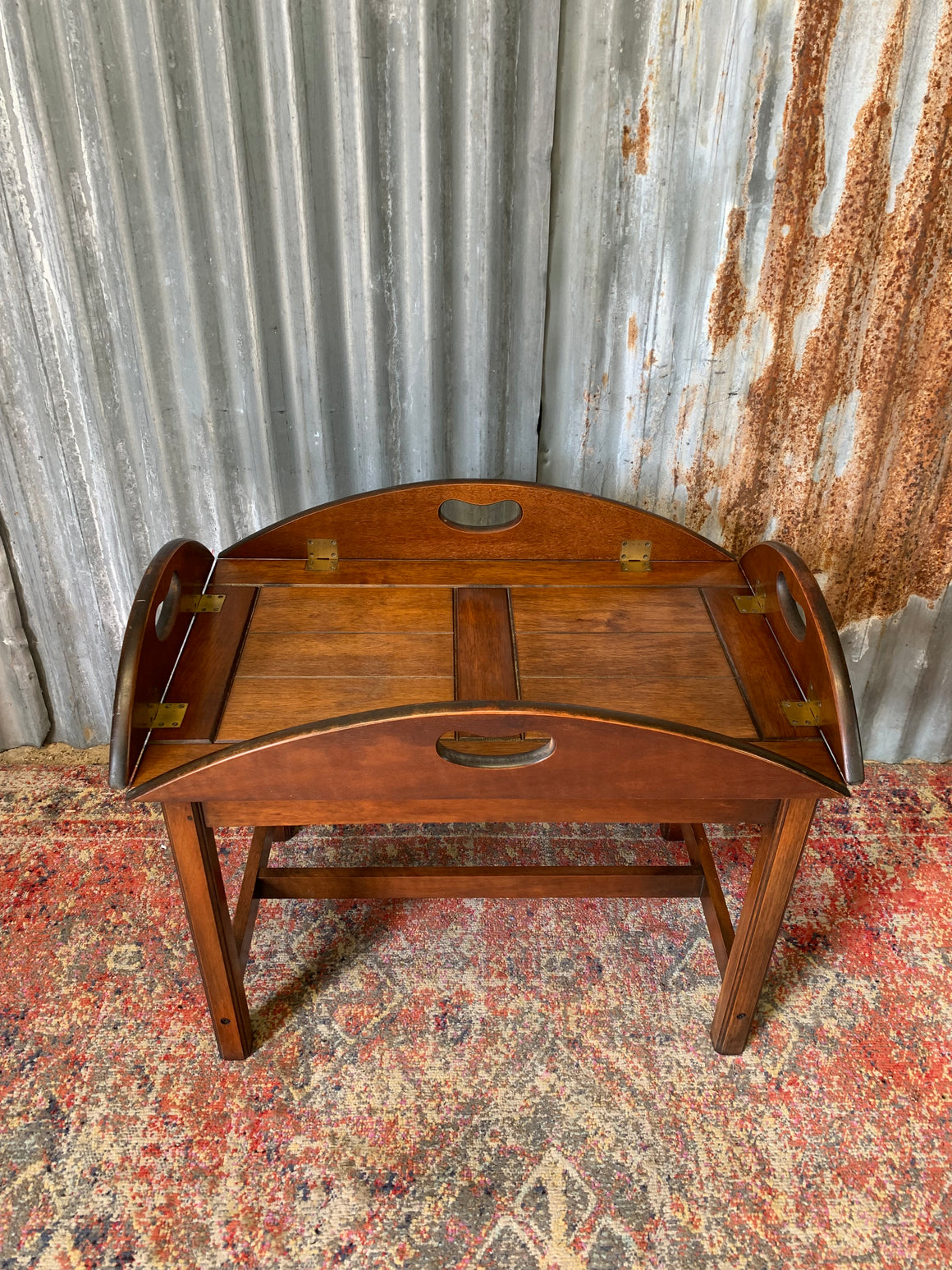 A mahogany butler's tray table